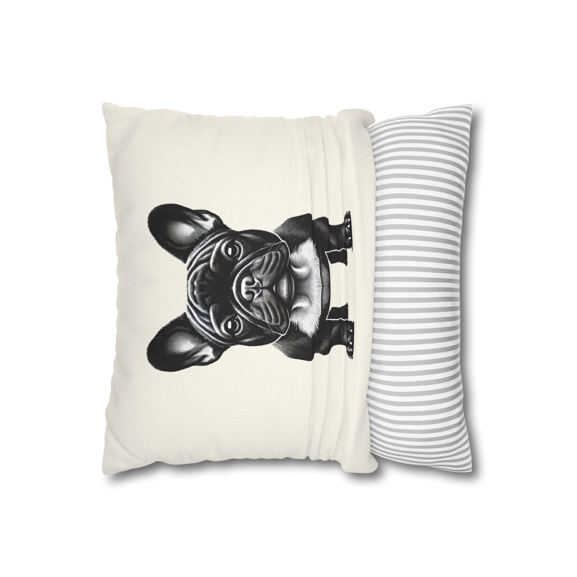 Cream colored pillowcase with black and white portrait of a french bulldog halfway on a pillow insert