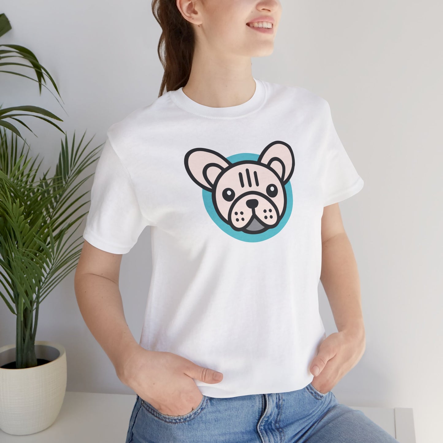 White t-shirt with an illustration of a cream frenchie on female model