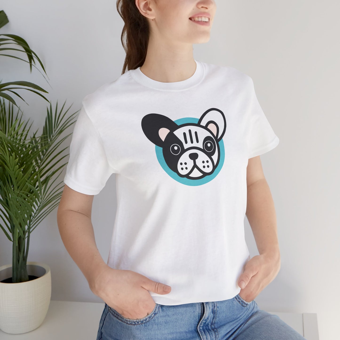 White t-shirt with an illustration of a pied frenchie on female model
