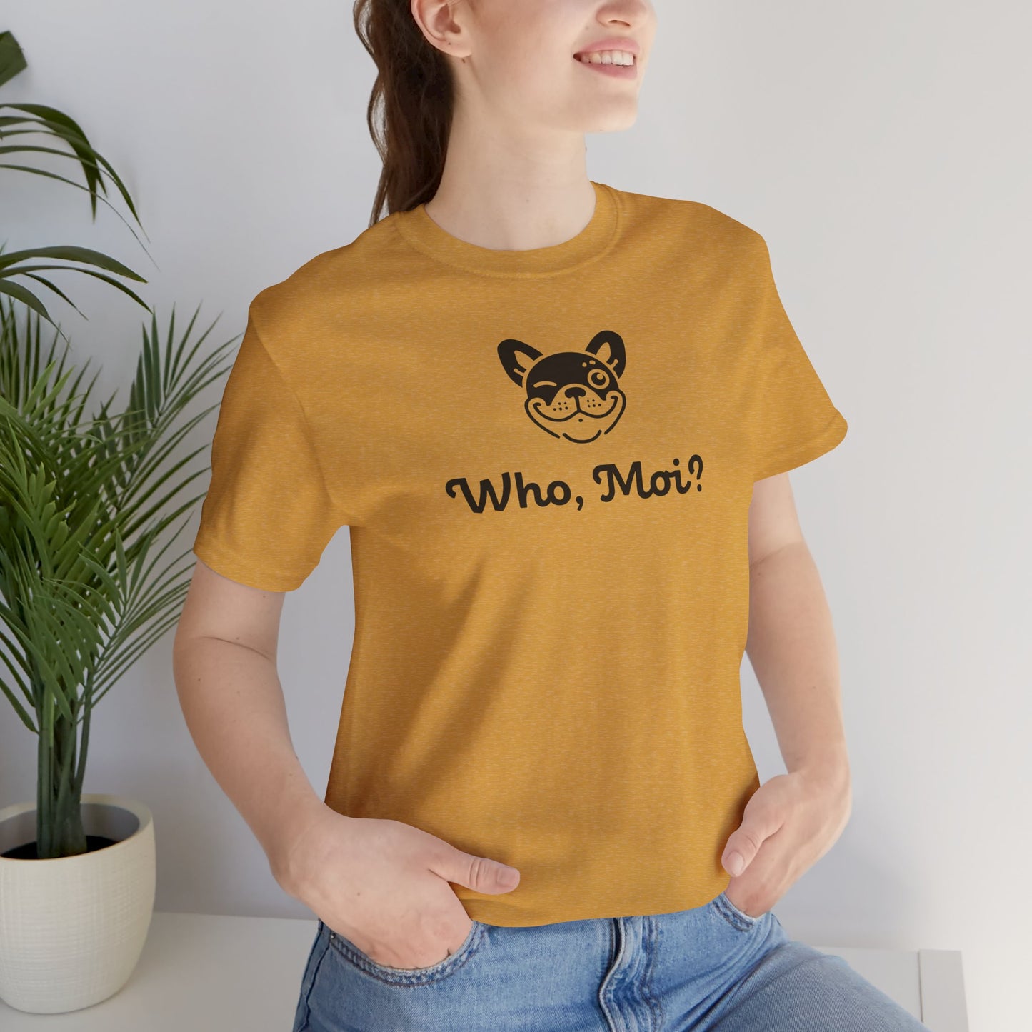 Heather mustard  t-shirt with french bulldog face and the slogan "Who, Moi?" on female model