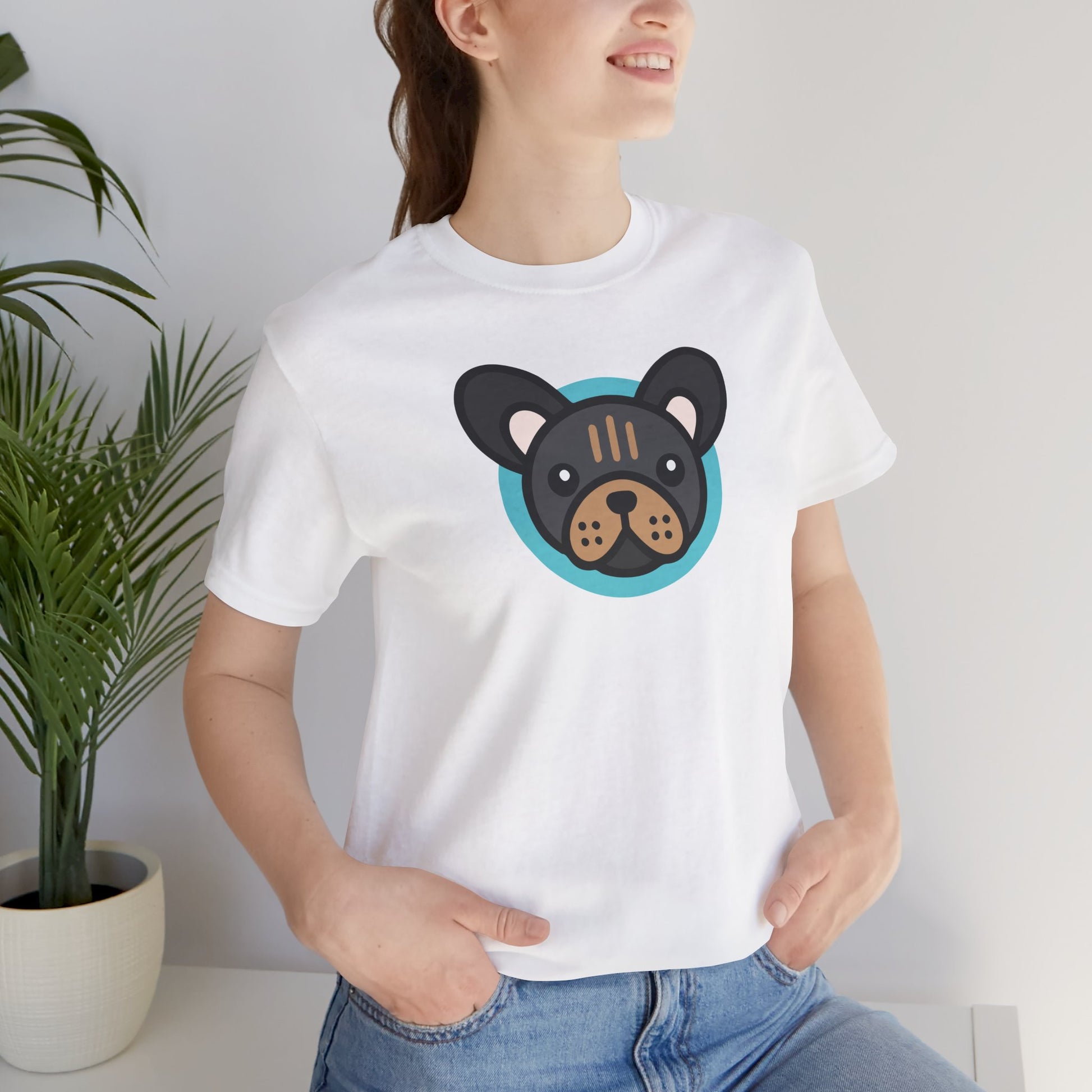 White t-shirt with illustration of a black and tan frenchie on female model